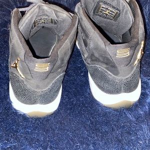 Air Jordan Retro 11  Women Size:7 Color: Black and Gold Used